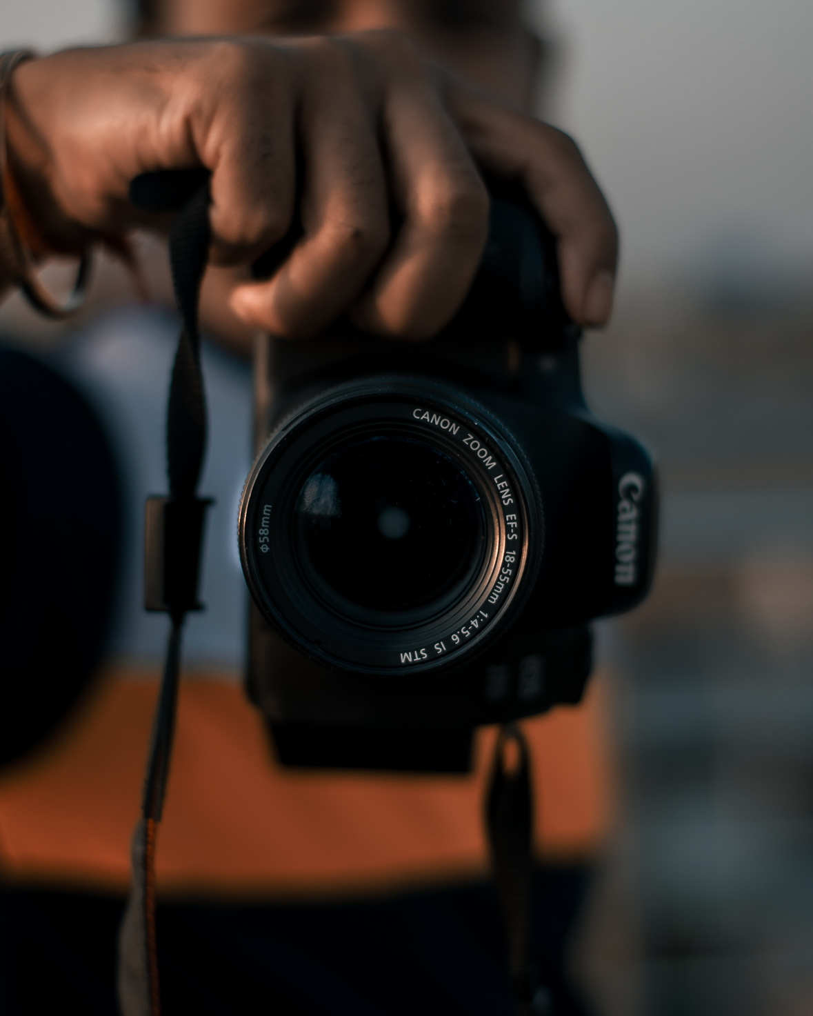 A Photographer Holding a Camera